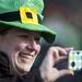 A participant takes a picture at the finish line of the Shamrocks and Shenanigans 5K on Sunday, March 10. Daniel Brenner I AnnArbor.com